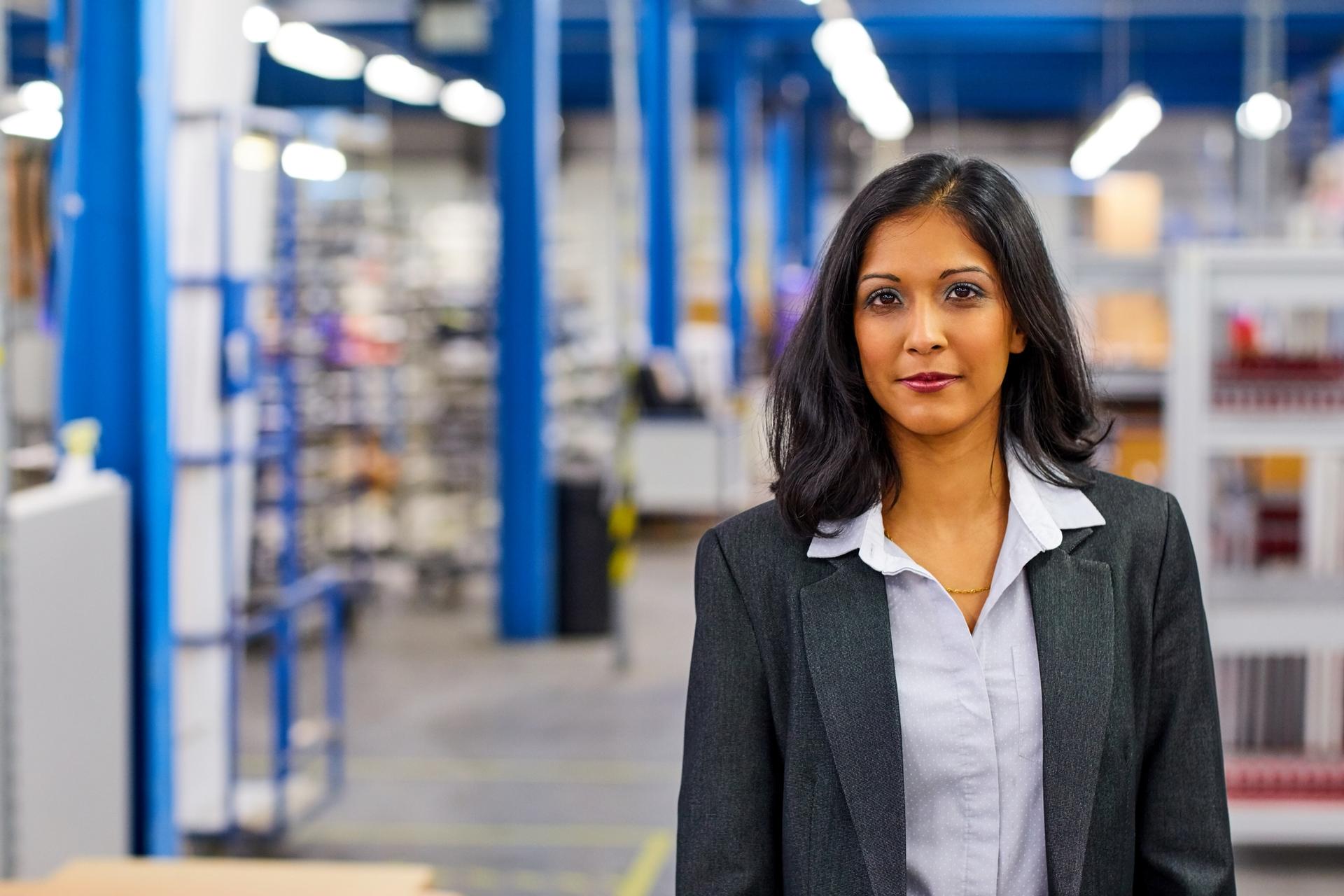 Worker's Comp > Woman in industrial building